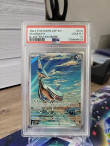 Skarmory Illustration Rare 209/191 PSA 10 – Pokemon 2024 Surging Sparks